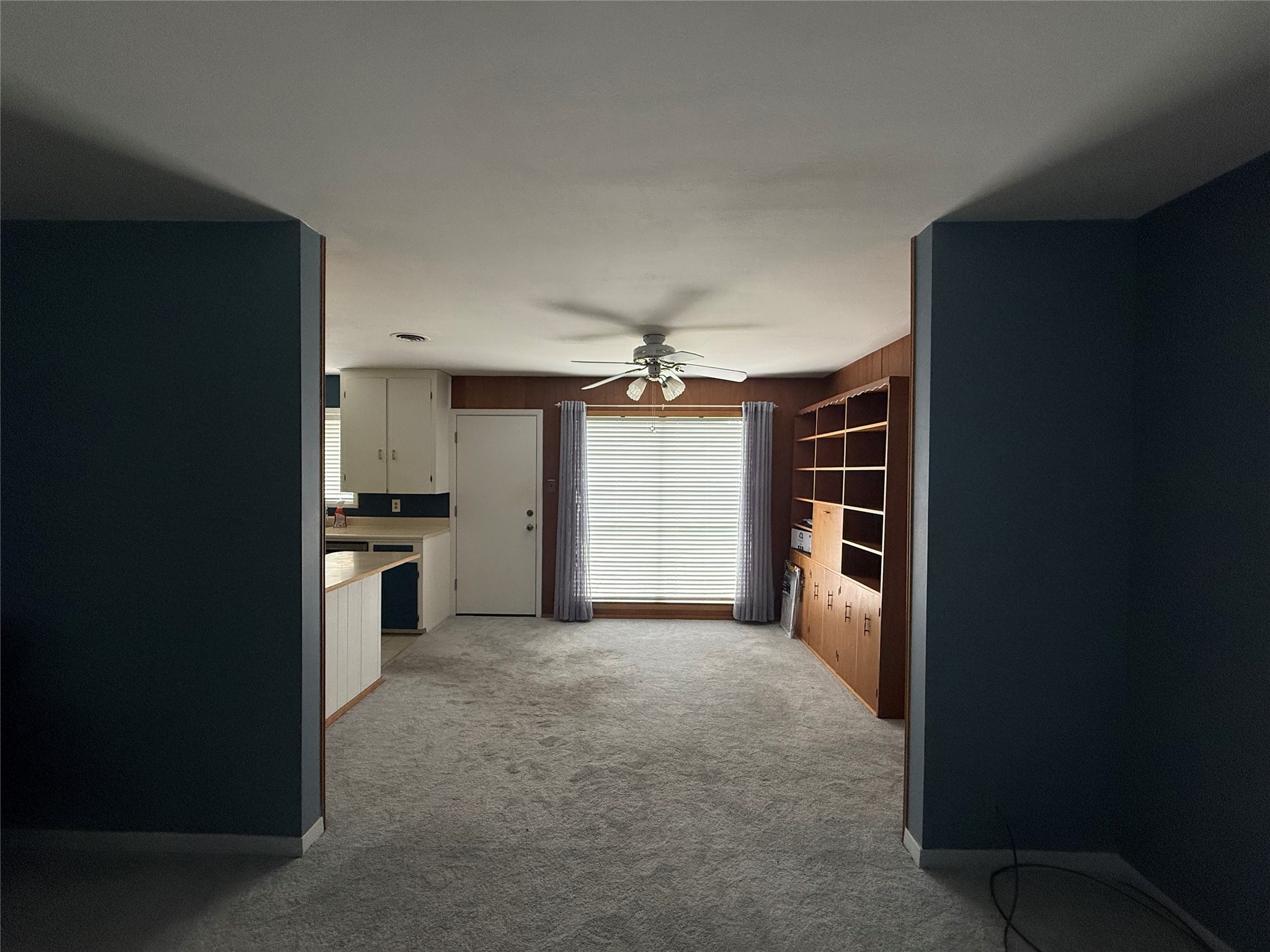 7945 Cedel Drive Houston, TX 77055 - Photo 3 of 11 a view of a kitchen with a sink and a refrigerator