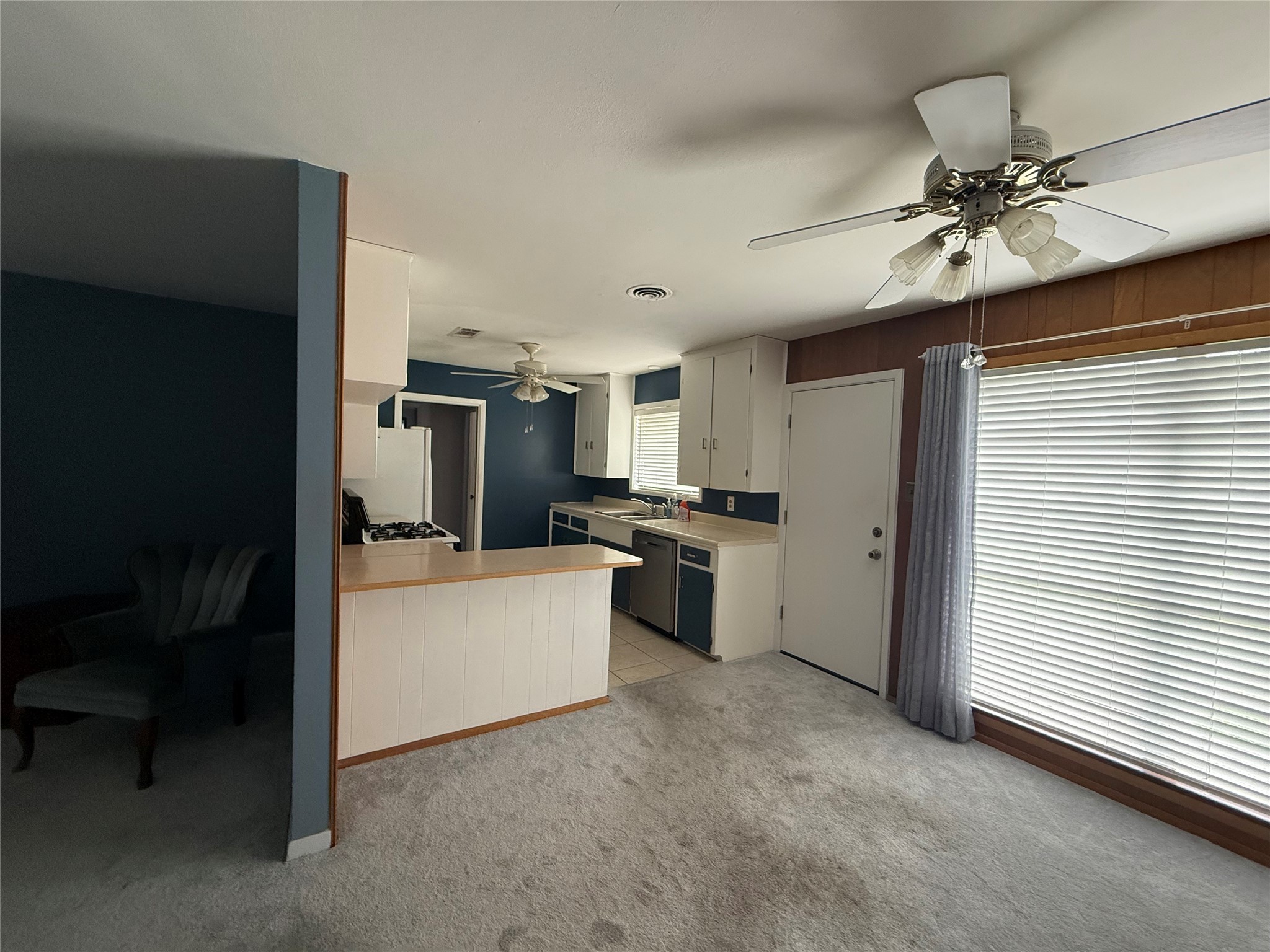 7945 Cedel Drive Houston, TX 77055 - Photo 4 of 11 a open kitchen with cabinets stove and refrigerator