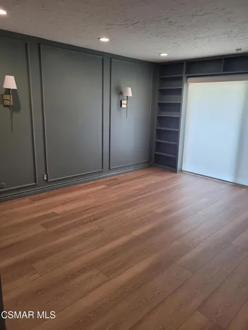 a view of an empty room with a fireplace