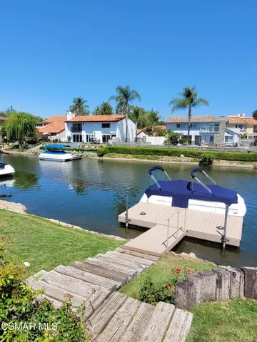 a view of a lake with houses with outdoor space