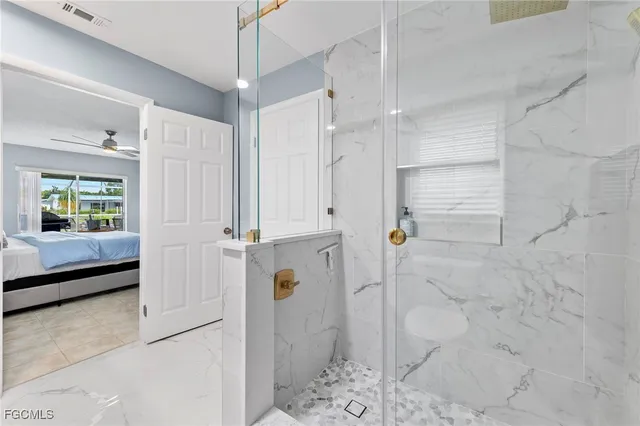 a bathroom with a sink toilet a mirror and shower