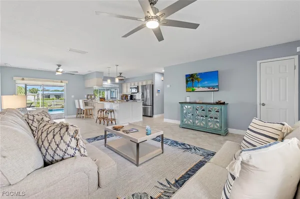a living room with furniture and a rug