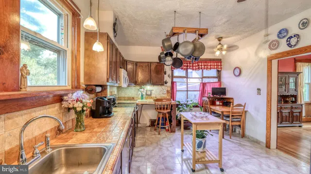 a view of a kitchen and dining area