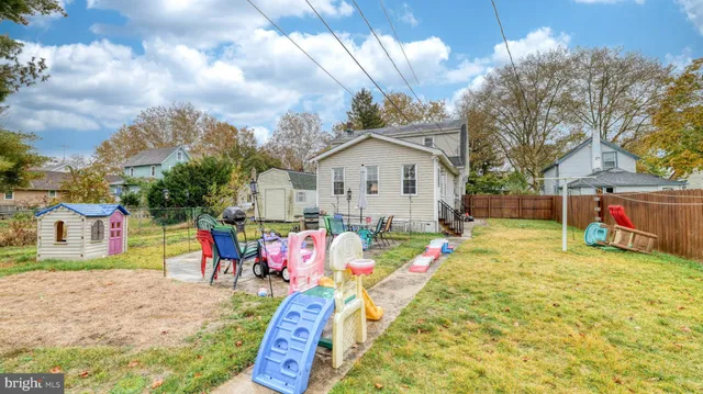 a view of swimming pool with sitting area