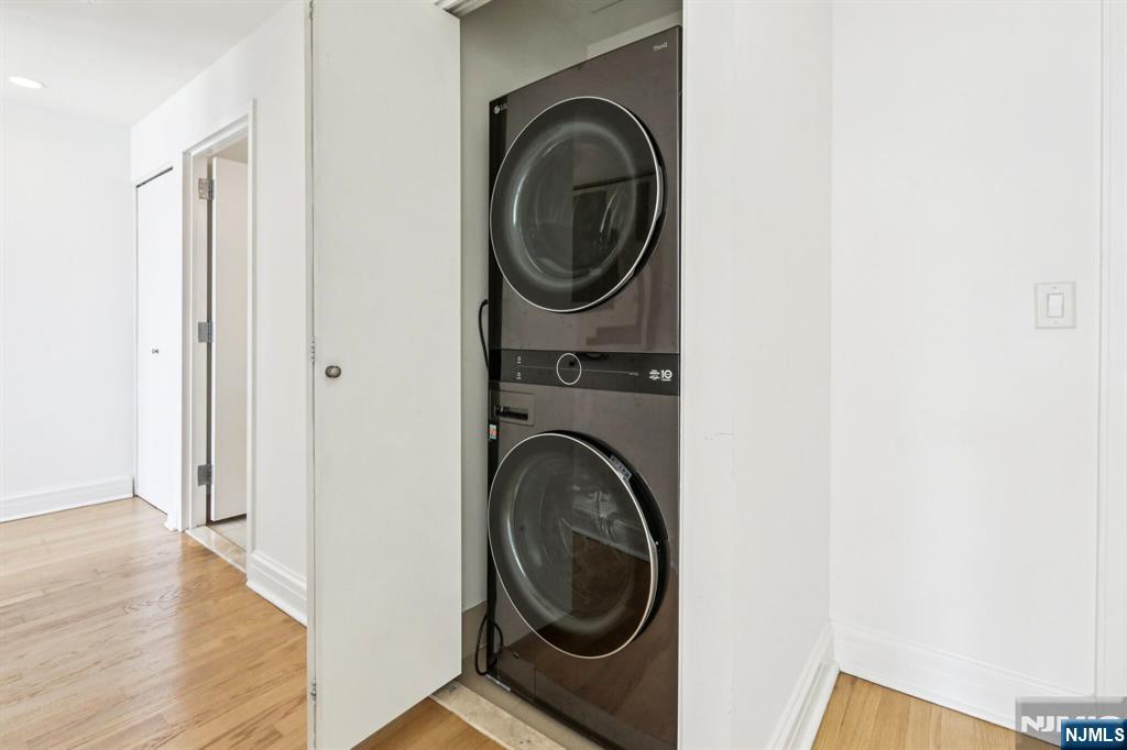 1 Spring Street, Unit 1004 New Brunswick, NJ 08901 - Photo 12 of 26 a utility room with dryer and washer