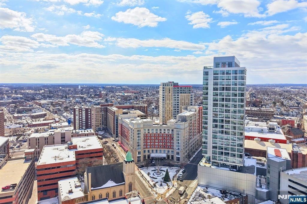 1 Spring Street, Unit 1004 New Brunswick, NJ 08901 - Photo 19 of 26 a view of a city with tall buildings