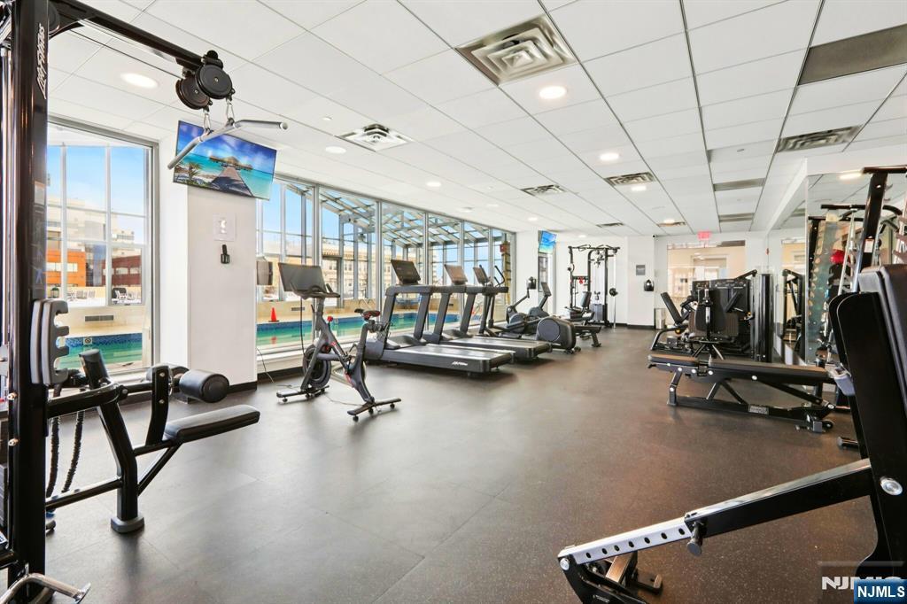 1 Spring Street, Unit 1004 New Brunswick, NJ 08901 - Photo 21 of 26 a view of a room with gym equipment
