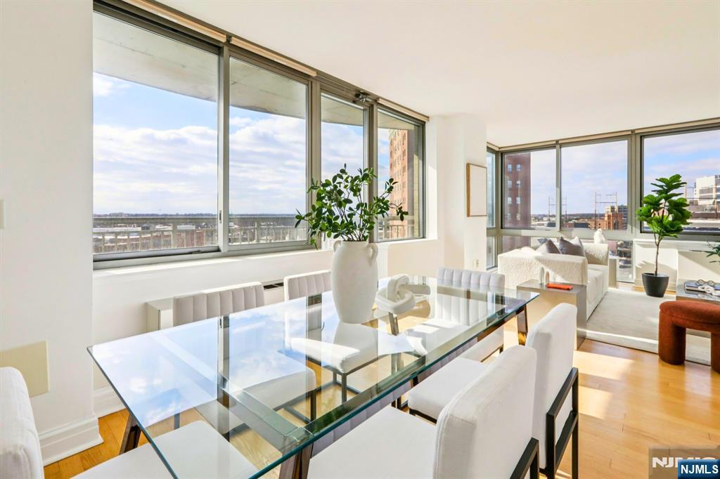 1 Spring Street, Unit 1004 New Brunswick, NJ 08901 - Photo 7 of 26 a living room with furniture and a large window