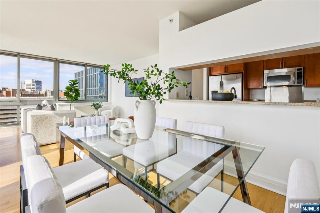 1 Spring Street, Unit 1004 New Brunswick, NJ 08901 - Photo 8 of 26 a view of a dining room with furniture window and outside view
