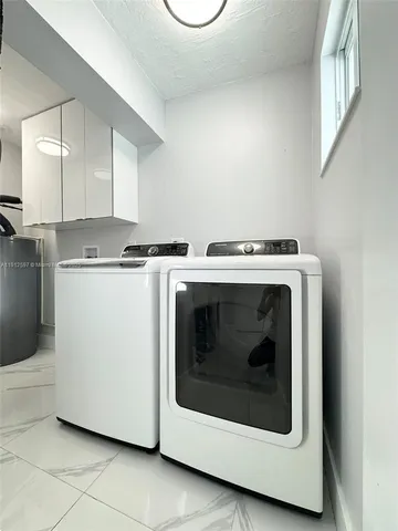 a stove top oven sitting inside of a kitchen