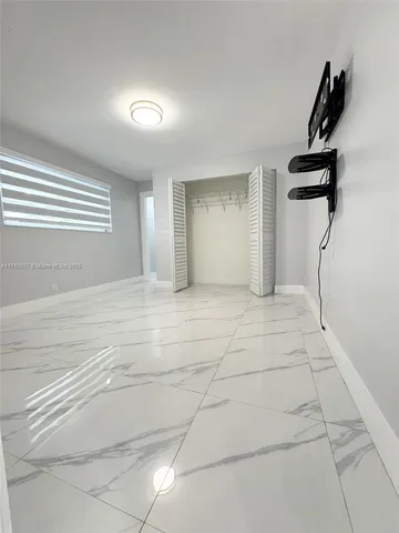 a view of empty room with windows