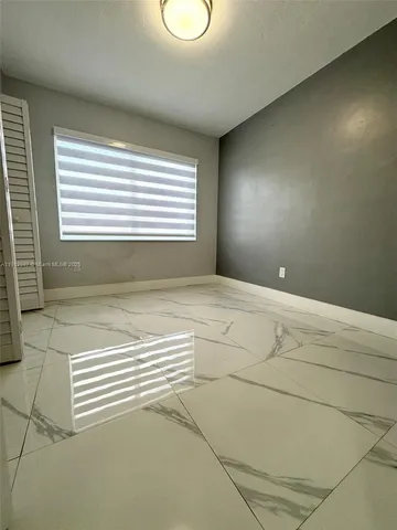 a view of a room with windows