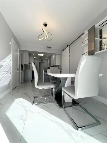 a room with lots of table and chairs