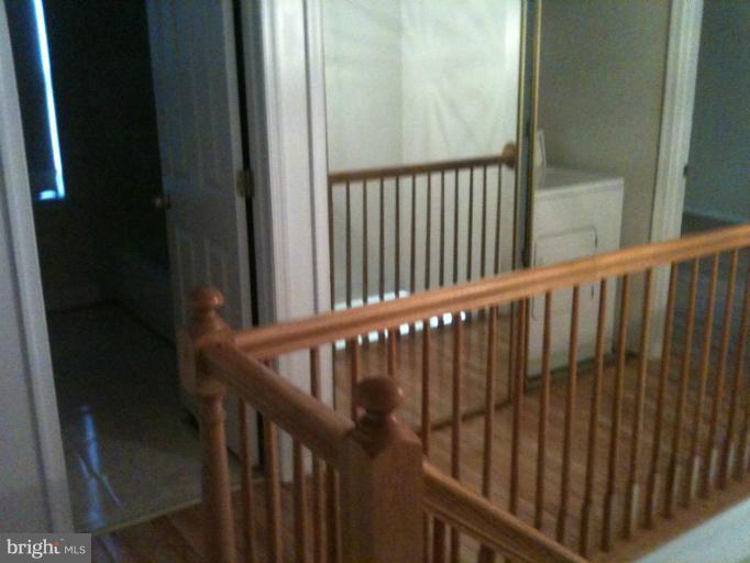 9506 Utica Place Springdale, MD 20721 - Photo 12 of 23 Hallway Upstairs