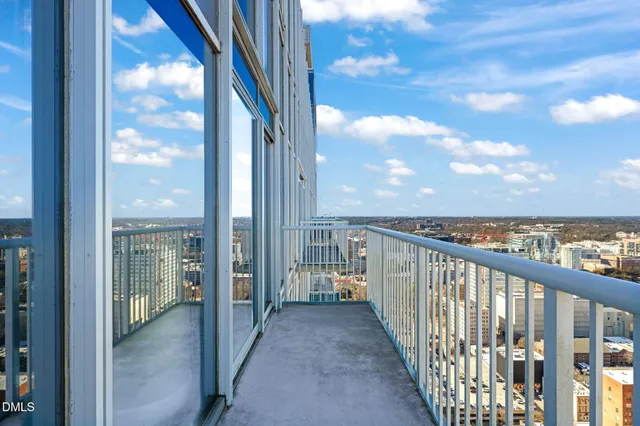 a view of a balcony with city view