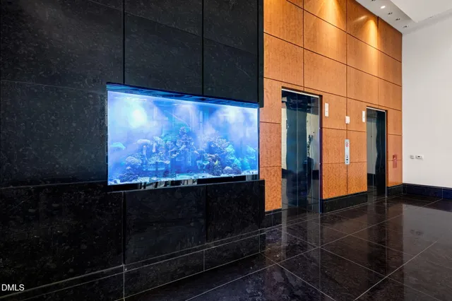 a view of walk in closet with clothes