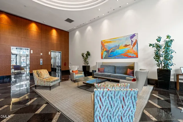 a view of a hallway to rooms