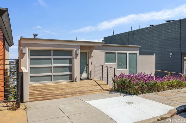 a house view with a garden space
