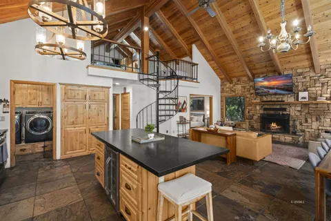 a view of a livingroom with furniture and flat screen tv