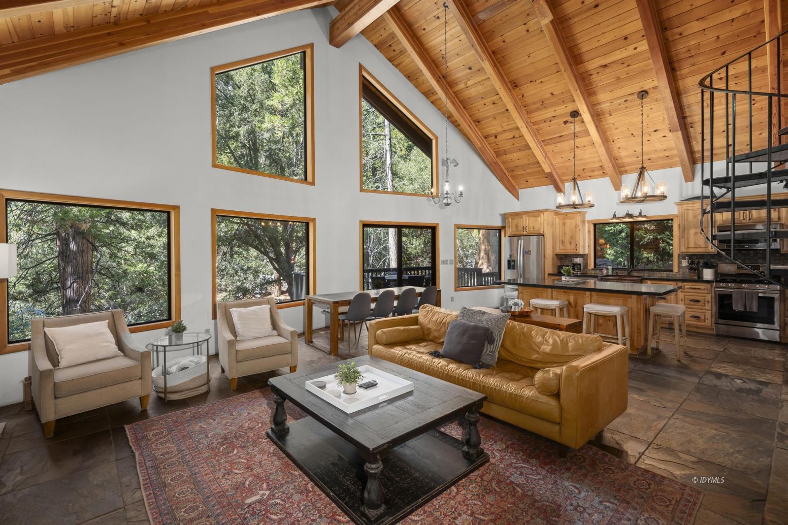 24747 Fern Valley Road Idyllwild, CA 92549 - Photo 15 of 42 a living room with furniture and a large window