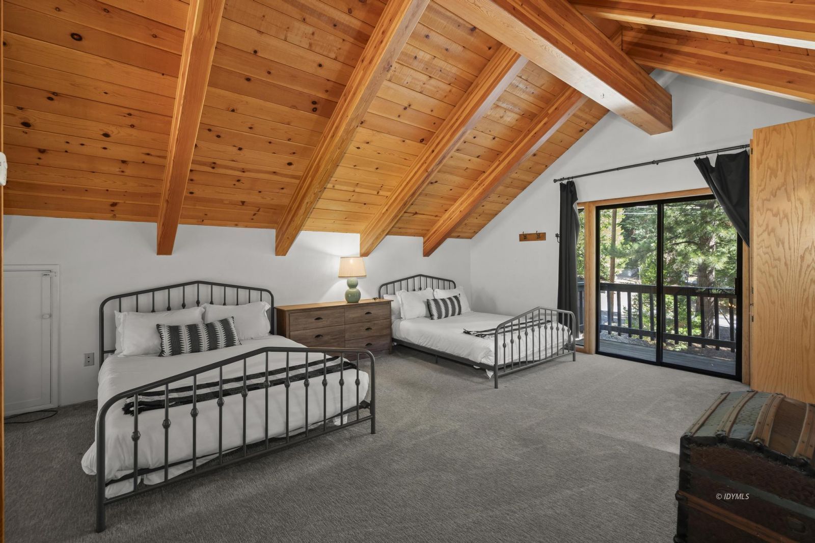 24747 Fern Valley Road Idyllwild, CA 92549 - Photo 21 of 42 a spacious bedroom with furniture and a window