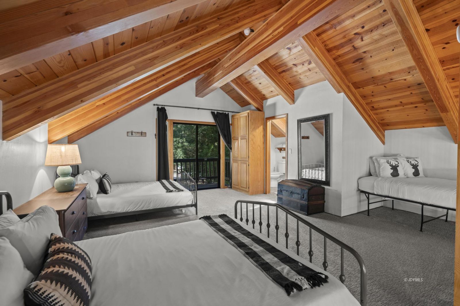 24747 Fern Valley Road Idyllwild, CA 92549 - Photo 23 of 42 a bedroom with furniture and a large window