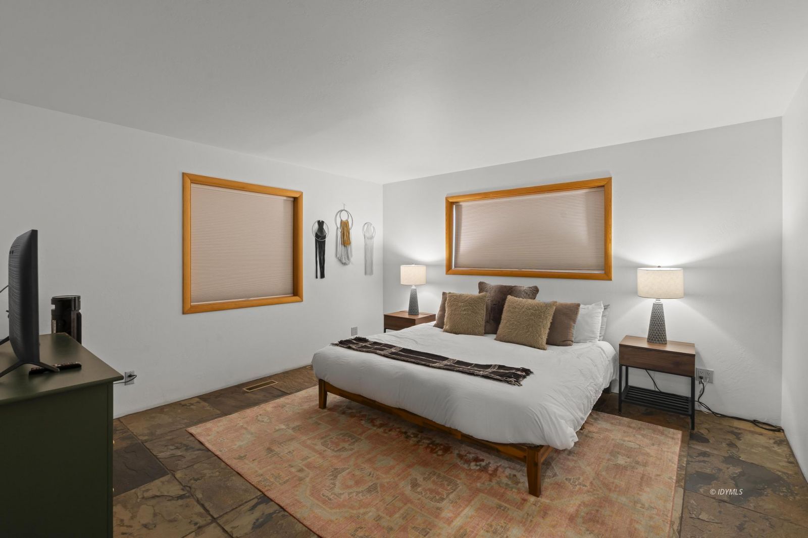 24747 Fern Valley Road Idyllwild, CA 92549 - Photo 26 of 42 a bedroom with a bed and a tv