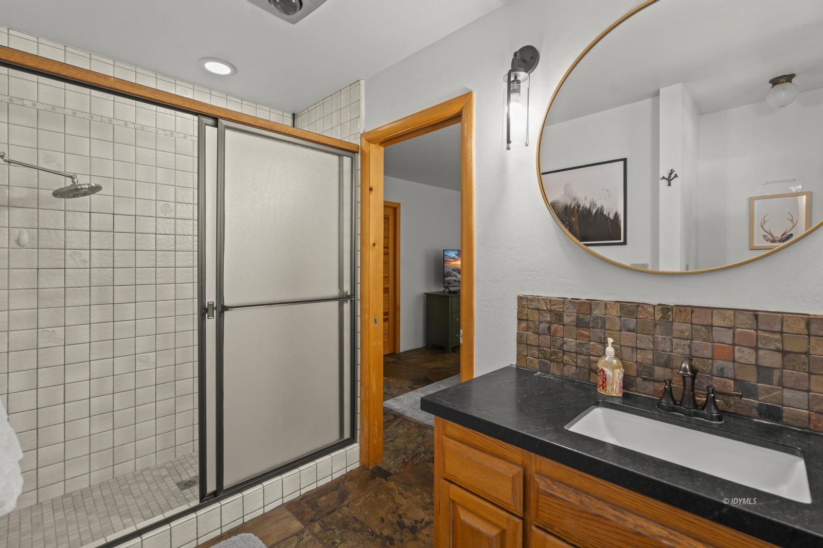 24747 Fern Valley Road Idyllwild, CA 92549 - Photo 28 of 42 a bathroom with a sink and a mirror
