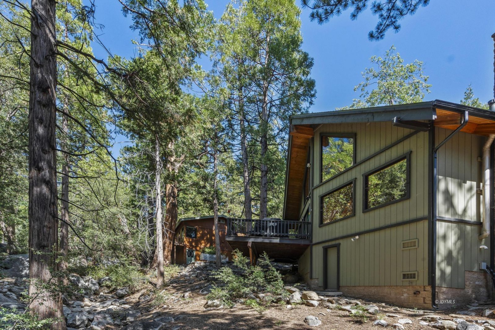 24747 Fern Valley Road Idyllwild, CA 92549 - Photo 3 of 42 a front view of a house with garden