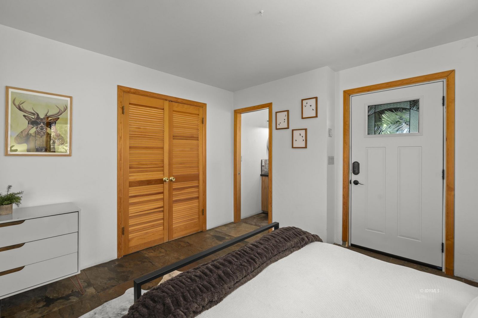 24747 Fern Valley Road Idyllwild, CA 92549 - Photo 33 of 42 a bedroom with a bed and a window