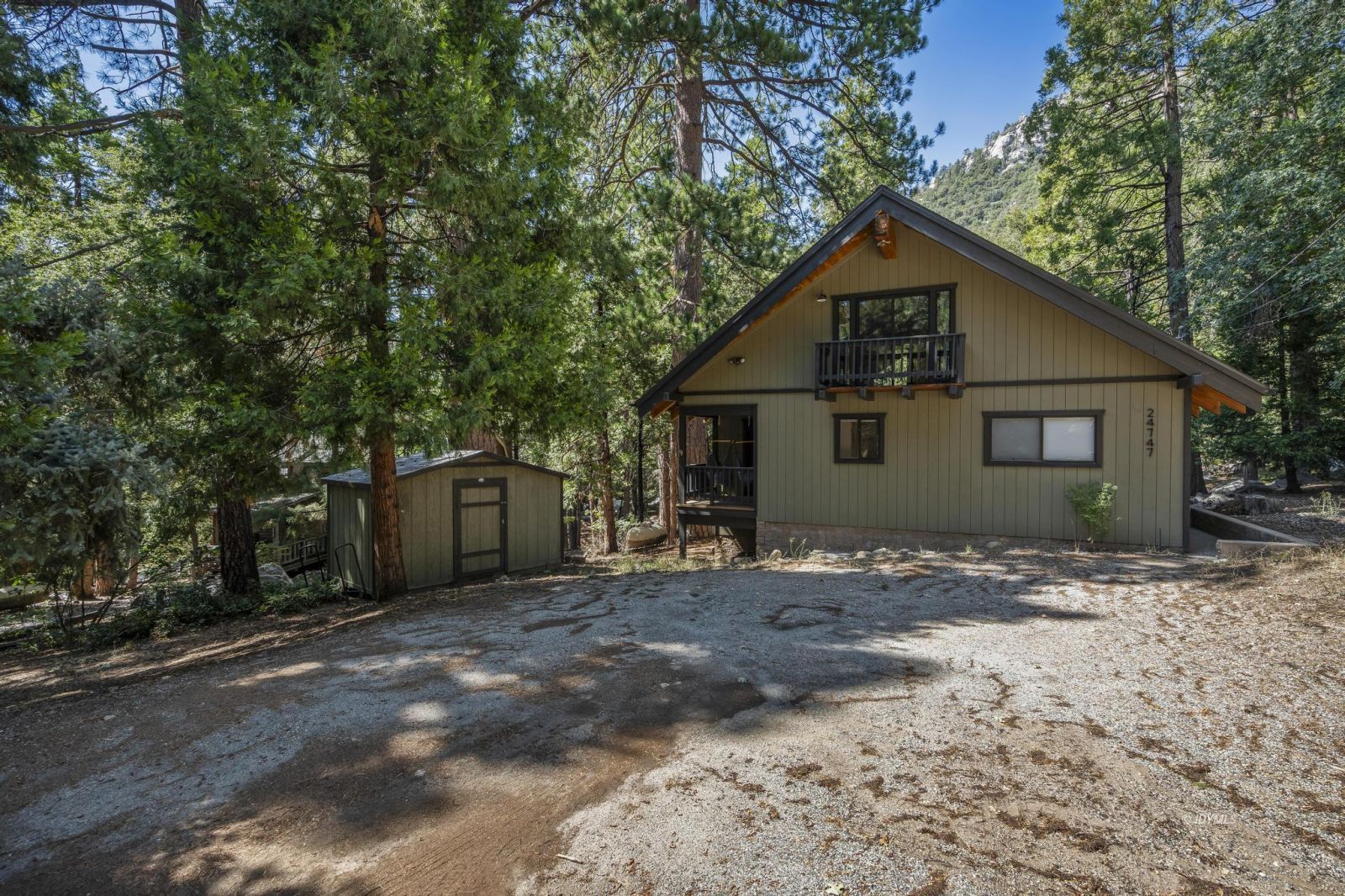 24747 Fern Valley Road Idyllwild, CA 92549 - Photo 41 of 42 a view of a house with a yard