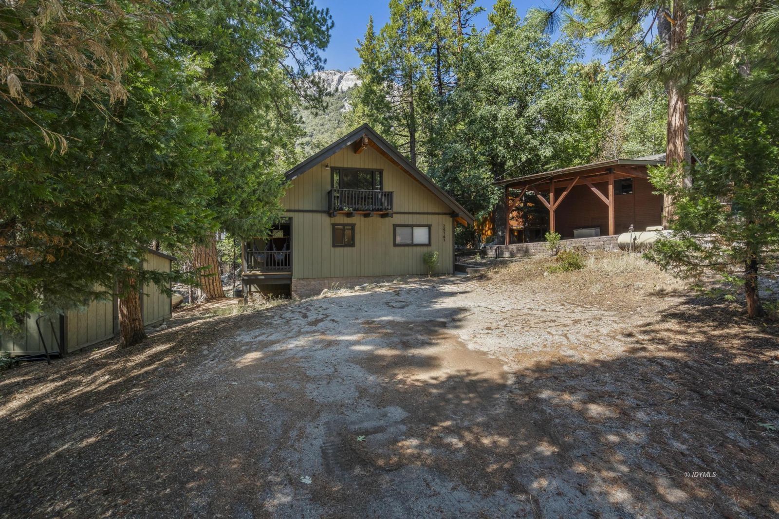 24747 Fern Valley Road Idyllwild, CA 92549 - Photo 42 of 42 a front view of a house with a yard and garage