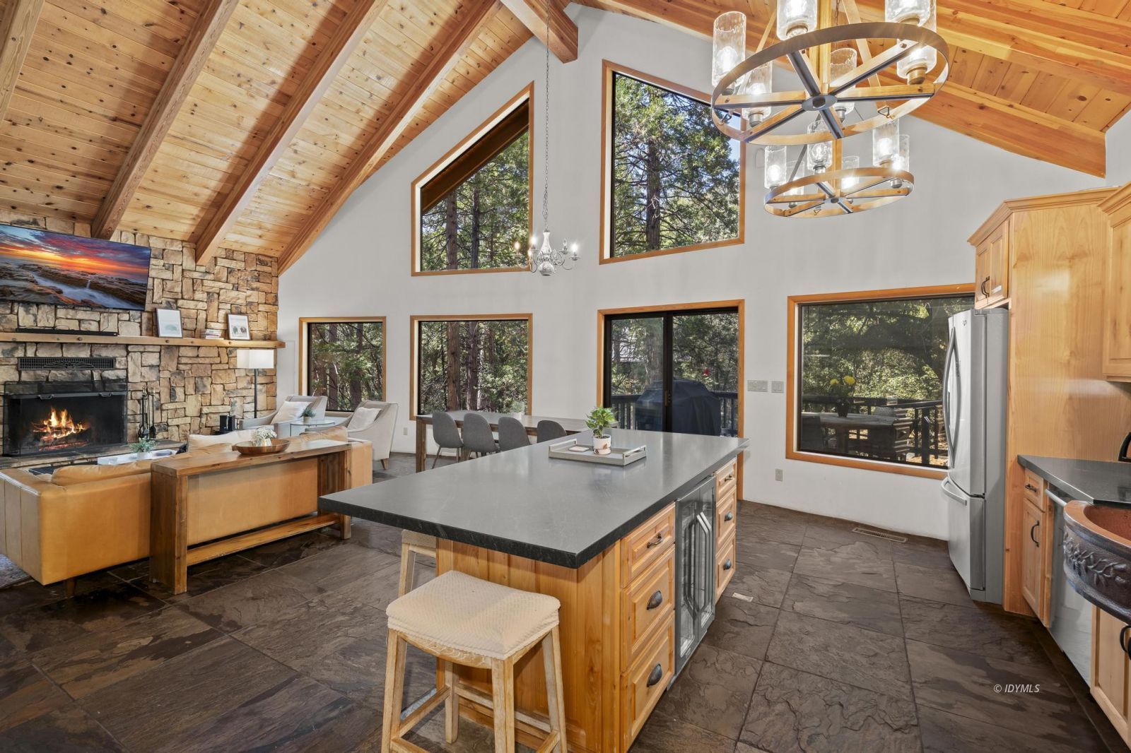 24747 Fern Valley Road Idyllwild, CA 92549 - Photo 8 of 42 a kitchen with stove a sink dishwasher and a refrigerator with wooden floor