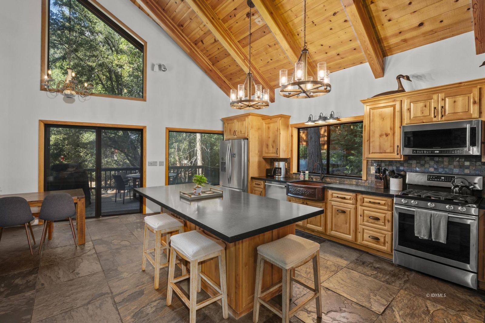 24747 Fern Valley Road Idyllwild, CA 92549 - Photo 9 of 42 a kitchen with stainless steel appliances granite countertop a sink and a stove
