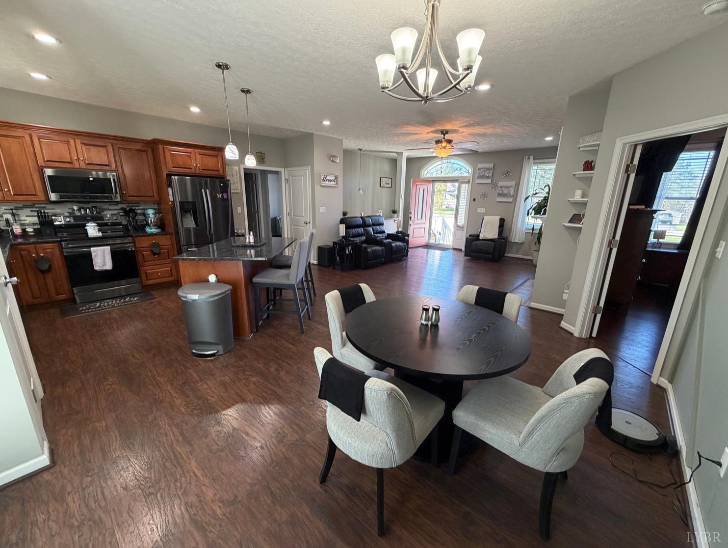 271 Pleasant Ridge Drive Madison Heights, VA 24572 - Photo 14 of 52 a view of a dining room with furniture and wooden floor
