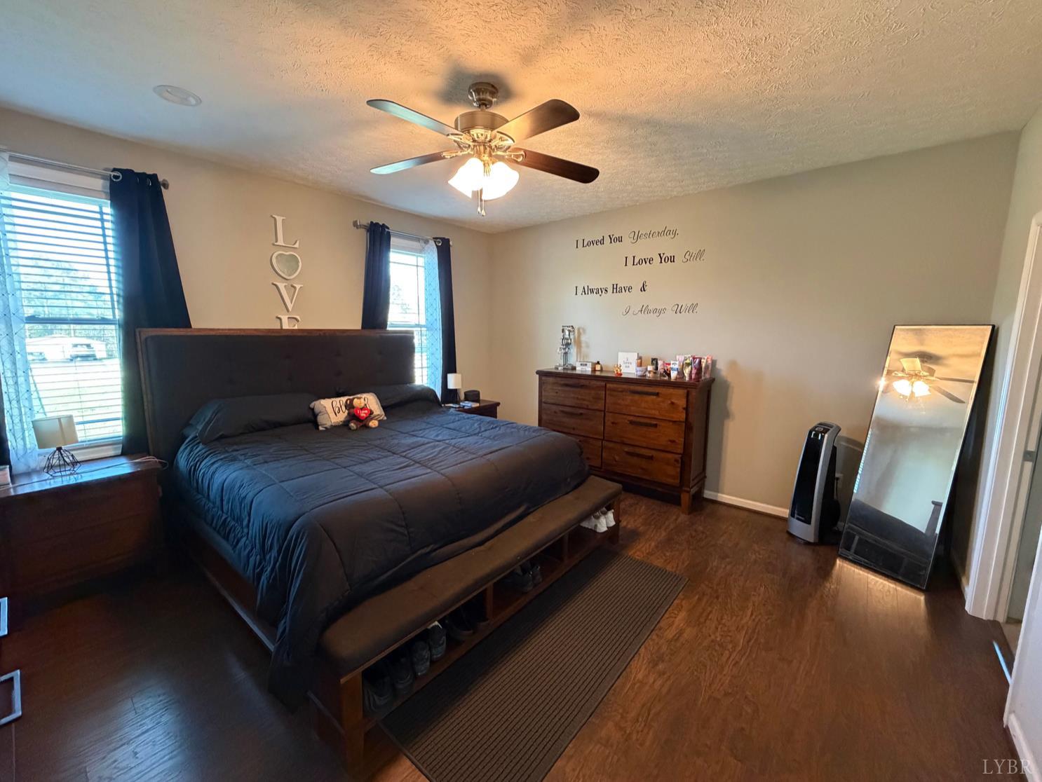 271 Pleasant Ridge Drive Madison Heights, VA 24572 - Photo 16 of 52 a bedroom with a bed and a chandelier