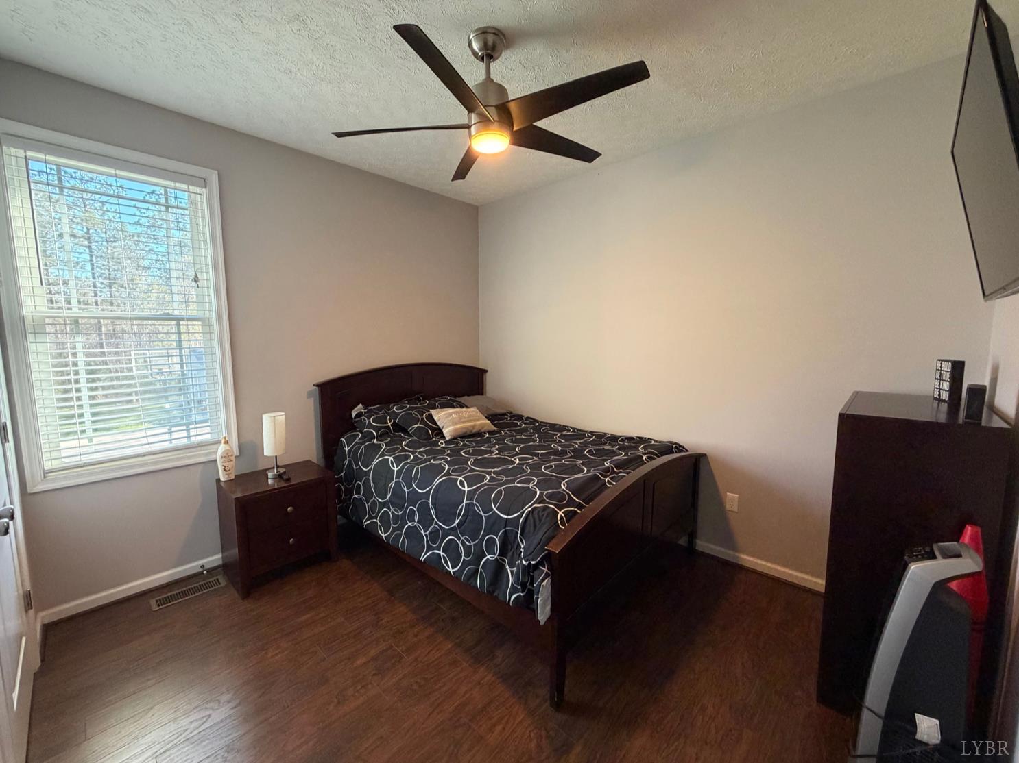 271 Pleasant Ridge Drive Madison Heights, VA 24572 - Photo 19 of 52 a bedroom with a bed and a window