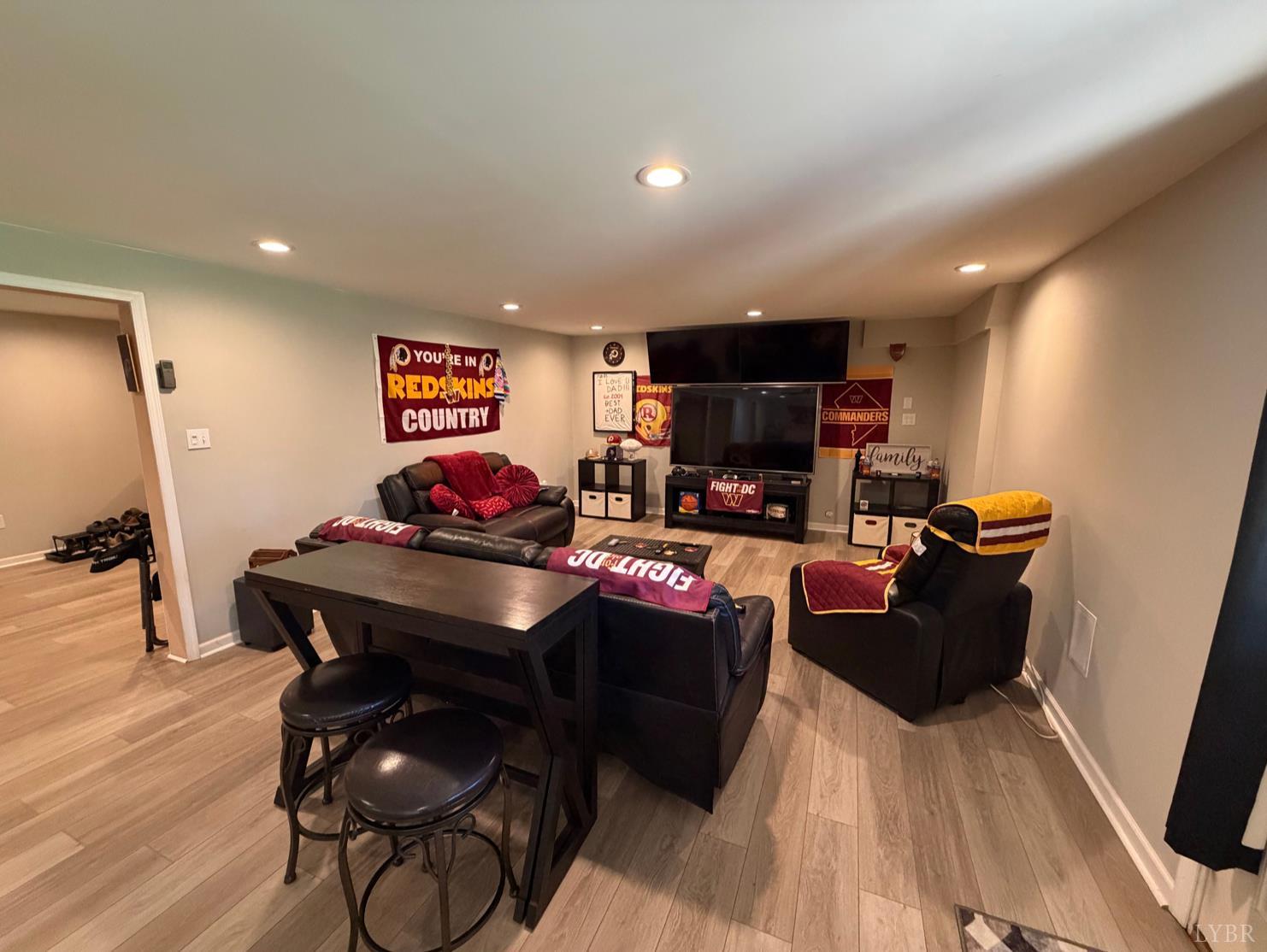 271 Pleasant Ridge Drive Madison Heights, VA 24572 - Photo 25 of 52 a living room with furniture a flat screen tv and kitchen view