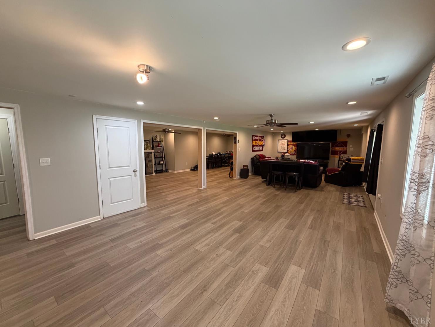 271 Pleasant Ridge Drive Madison Heights, VA 24572 - Photo 26 of 52 an empty room with wooden floor and furniture