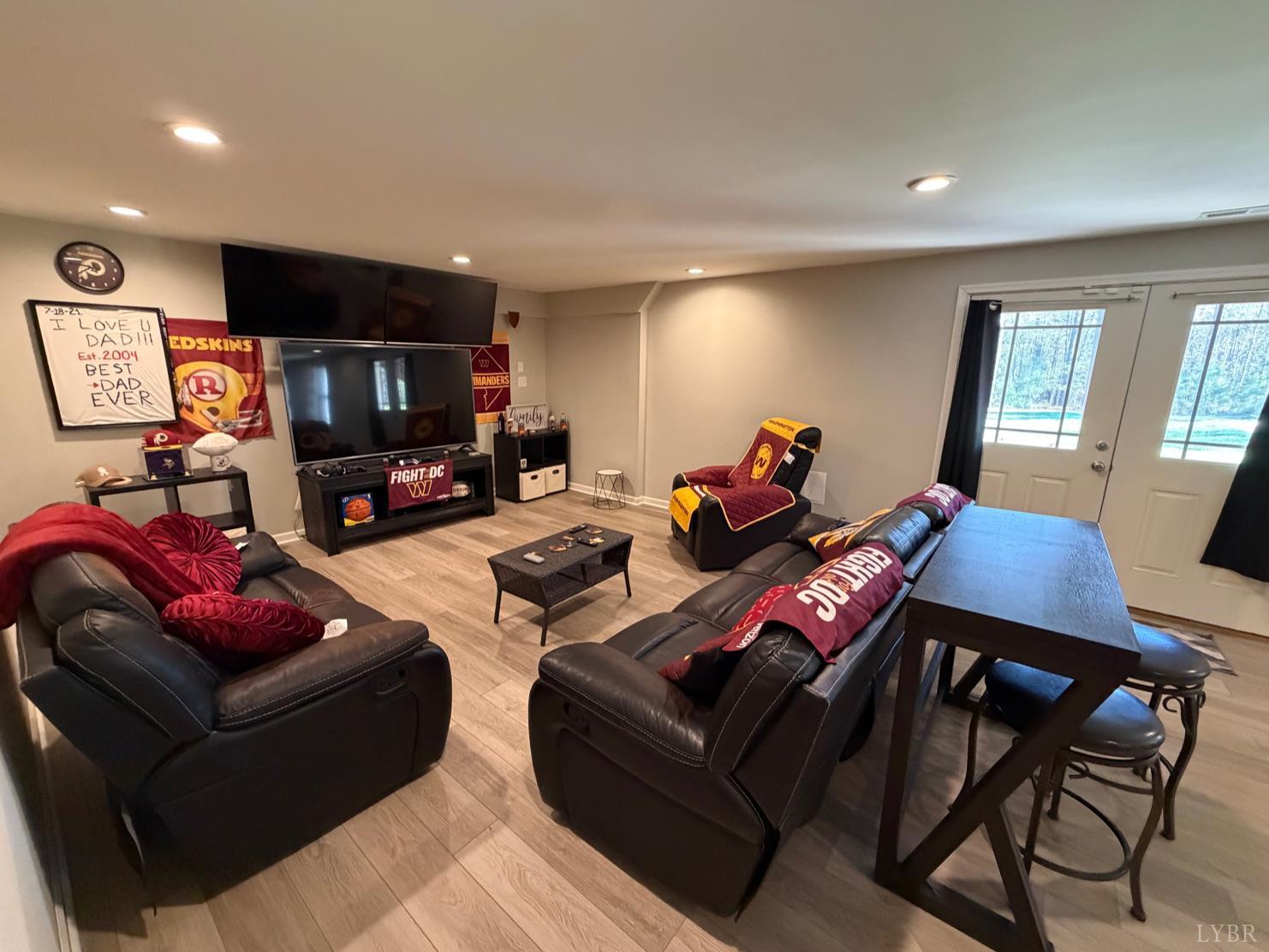 271 Pleasant Ridge Drive Madison Heights, VA 24572 - Photo 27 of 52 a living room with furniture kitchen view and a flat screen tv