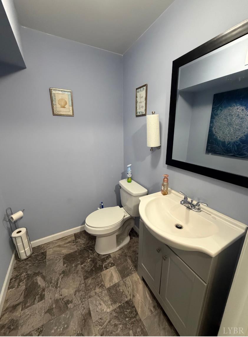 271 Pleasant Ridge Drive Madison Heights, VA 24572 - Photo 33 of 52 a bathroom with a toilet sink and mirror