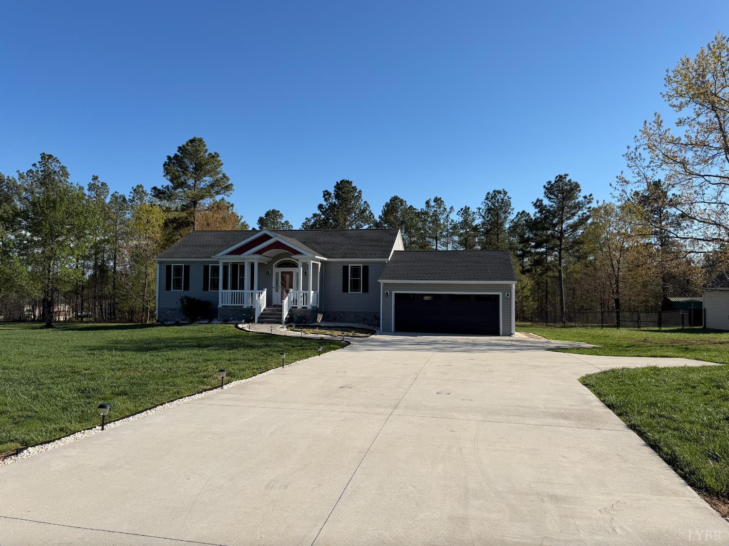 271 Pleasant Ridge Drive Madison Heights, VA 24572 - Photo 48 of 52 a front view of a house with a yard and garage