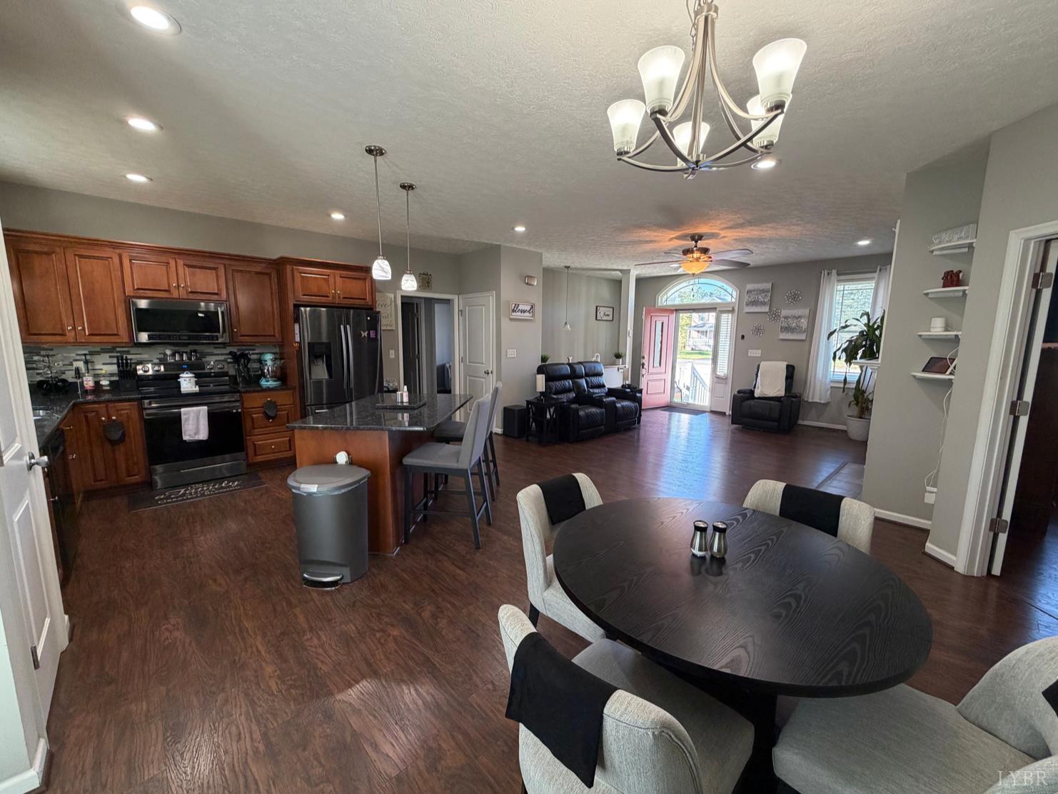 271 Pleasant Ridge Drive Madison Heights, VA 24572 - Photo 6 of 52 a view of a dining room with furniture a chandelier and wooden floor