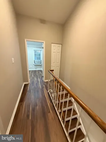 a view of hallway with a couch