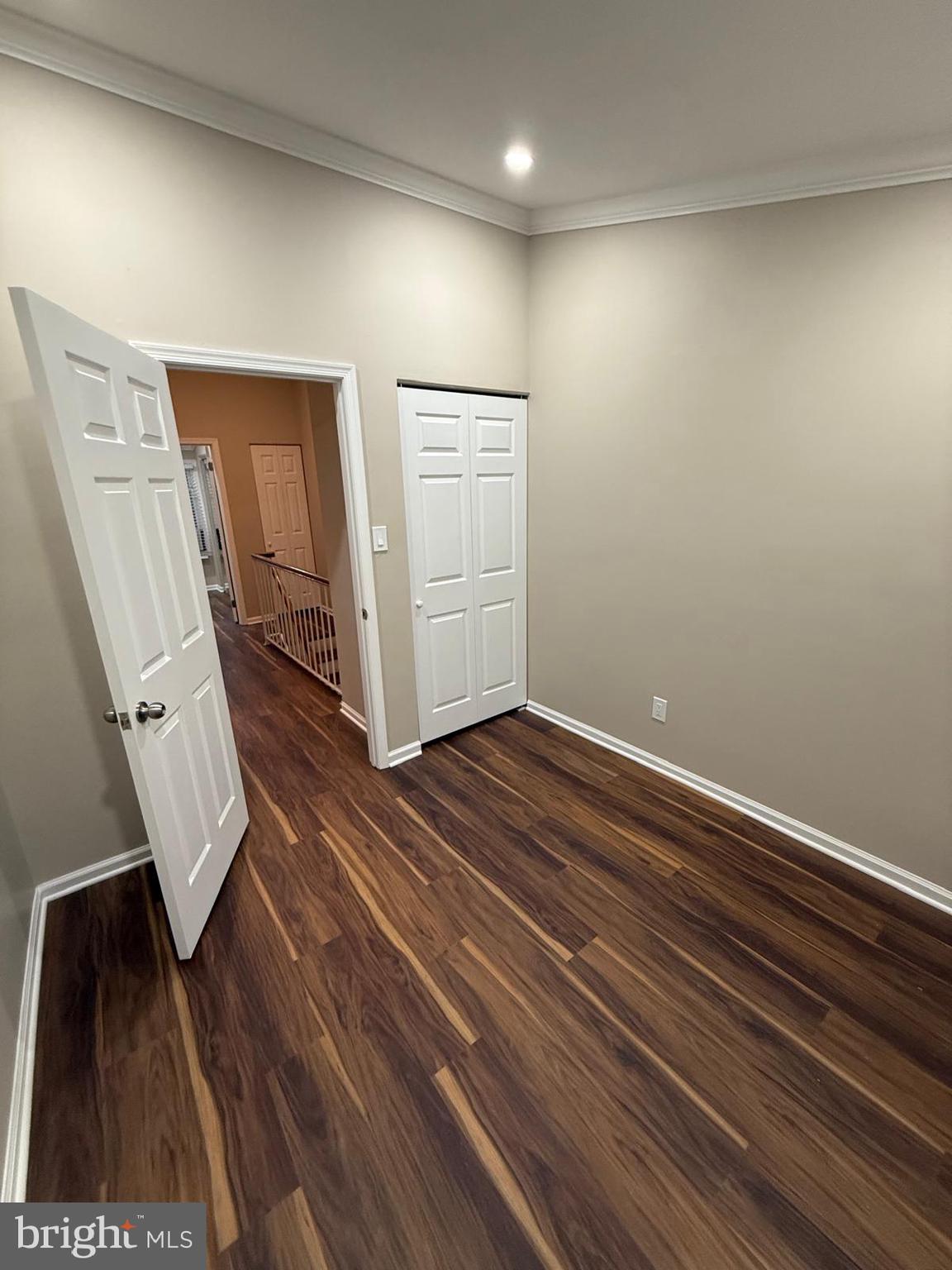 45 Fendall Avenue Alexandria, VA 22304 - Photo 21 of 45 a view of an empty room with wooden floor and stairs