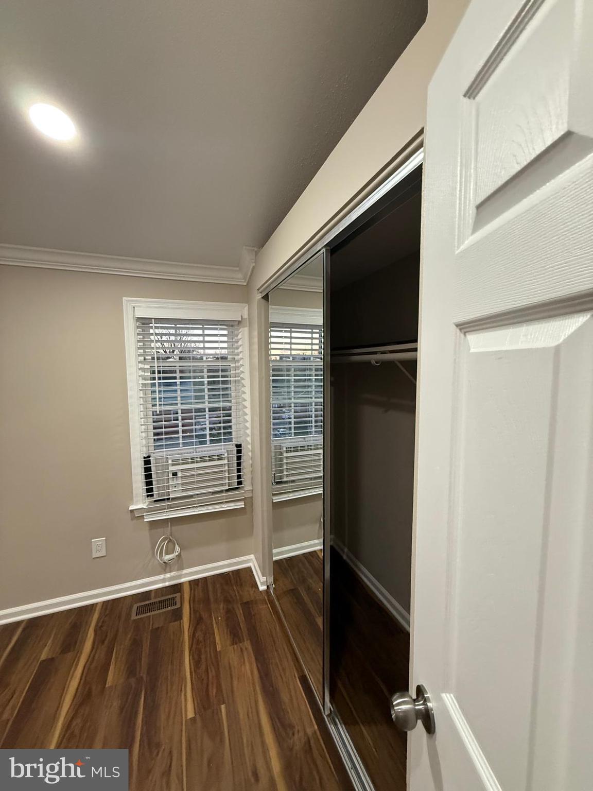 45 Fendall Avenue Alexandria, VA 22304 - Photo 28 of 45 a view of an empty room with a fireplace and a window