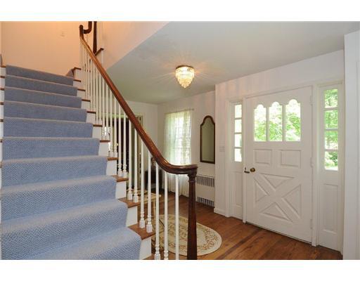 1 Allwood Road Darien, CT 06820 - Photo 13 of 20 a view of entryway and hall with wooden floor