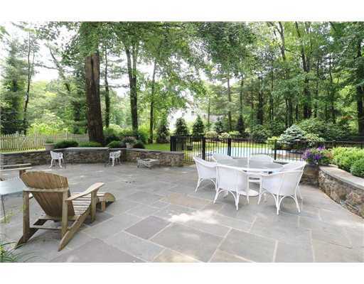 1 Allwood Road Darien, CT 06820 - Photo 15 of 20 a view of a patio with table and chairs and potted plants