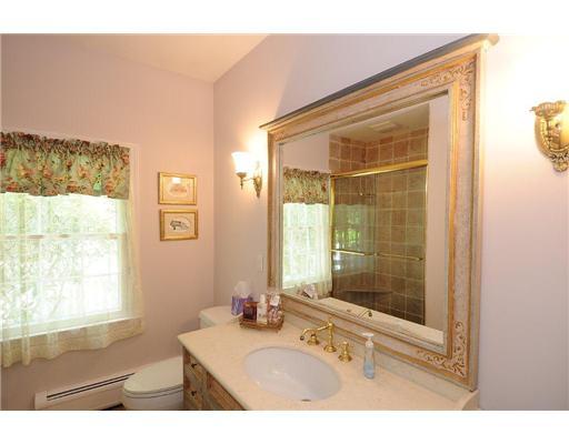1 Allwood Road Darien, CT 06820 - Photo 16 of 20 a bathroom with a sink mirror and a shower