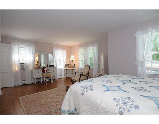 1 Allwood Road Darien, CT 06820 - Photo 17 of 20 a view of a bedroom with furniture and window